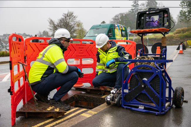 Engineers working on a smart sewer